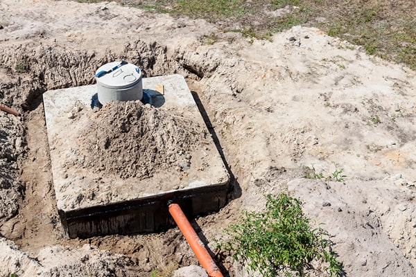 signs that your septic tank needs pumping include slow draining sinks, foul odors, and pooling water in the yard